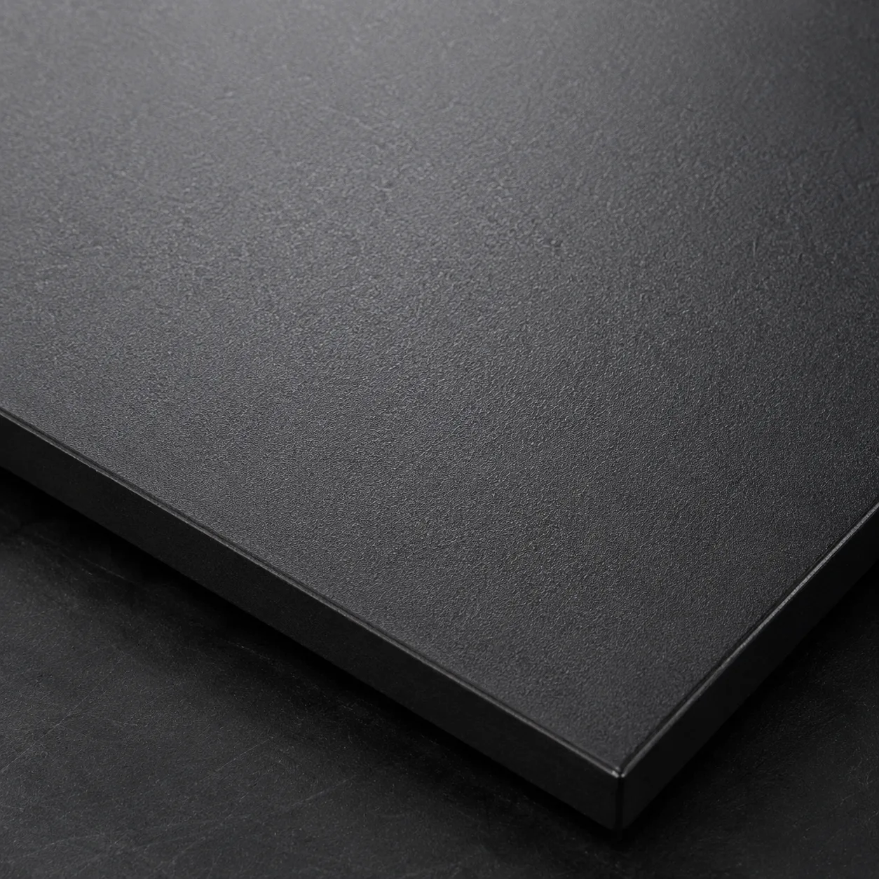 Sandblasted metal surface — matte bead blast finish on aluminum and steel